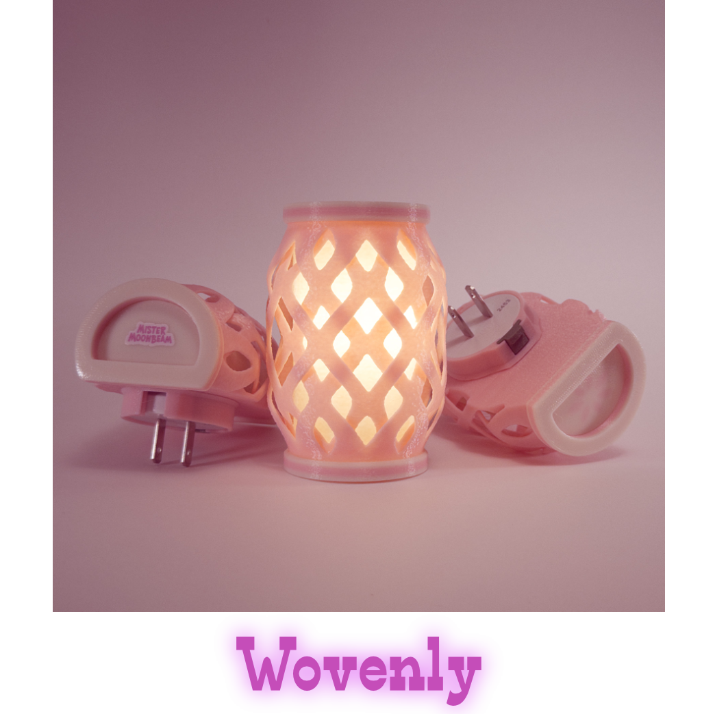 Three Wovenly night lights in pink, one glowing, with plug prongs visible