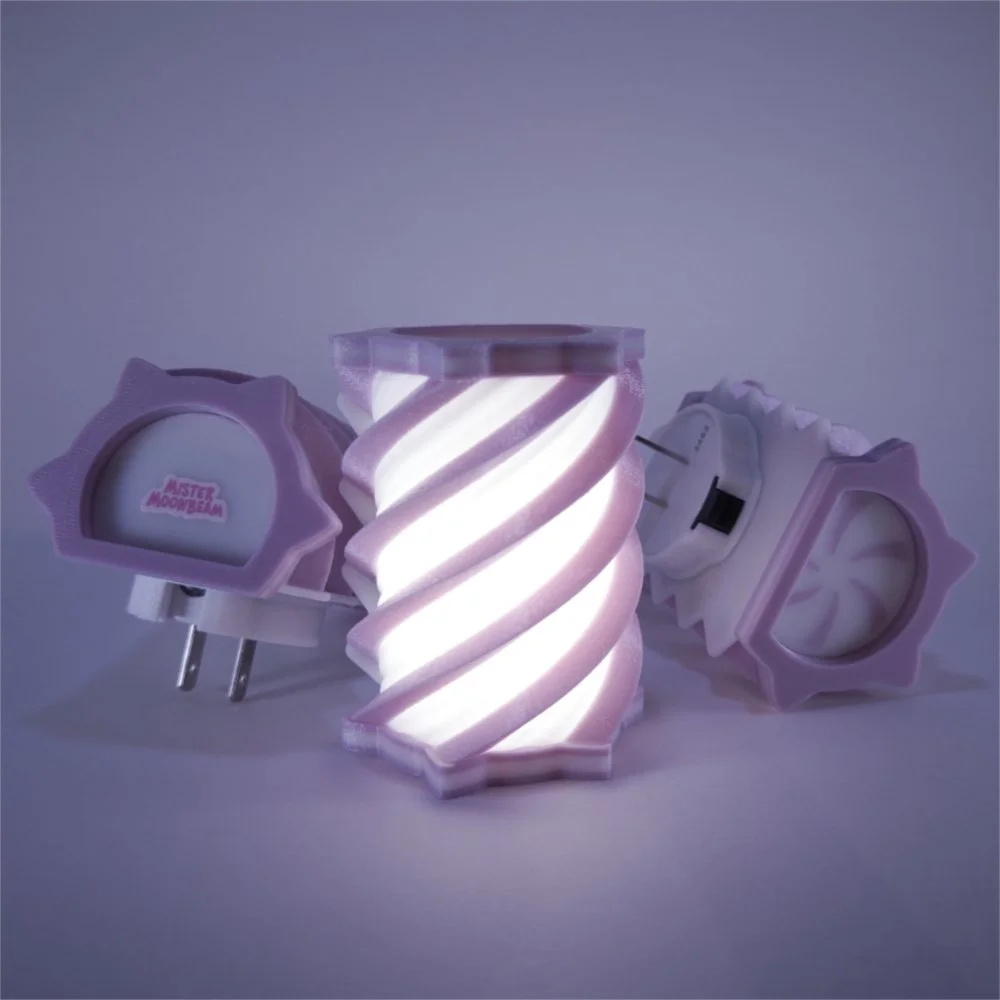 Three Spiral night lights in lavender, glowing
