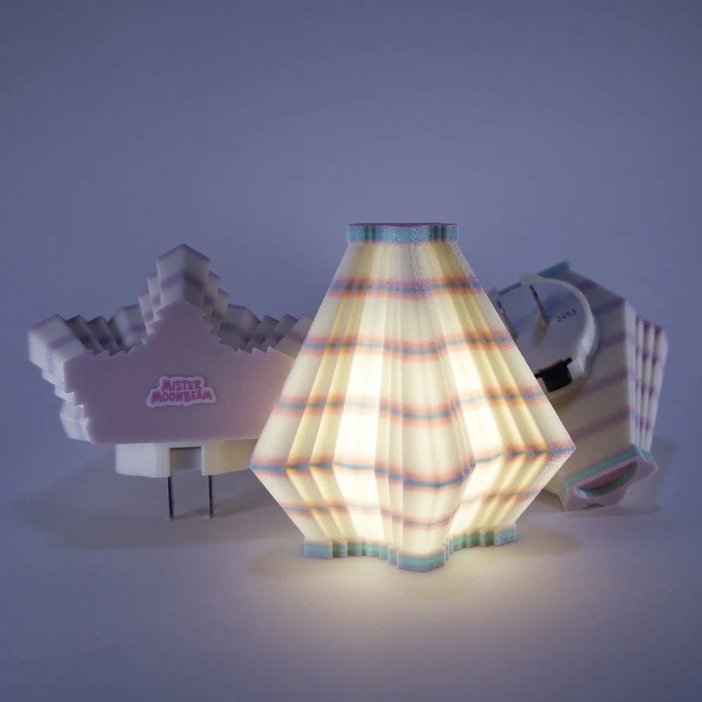 Three Facets night lights in pink and blue, glowing