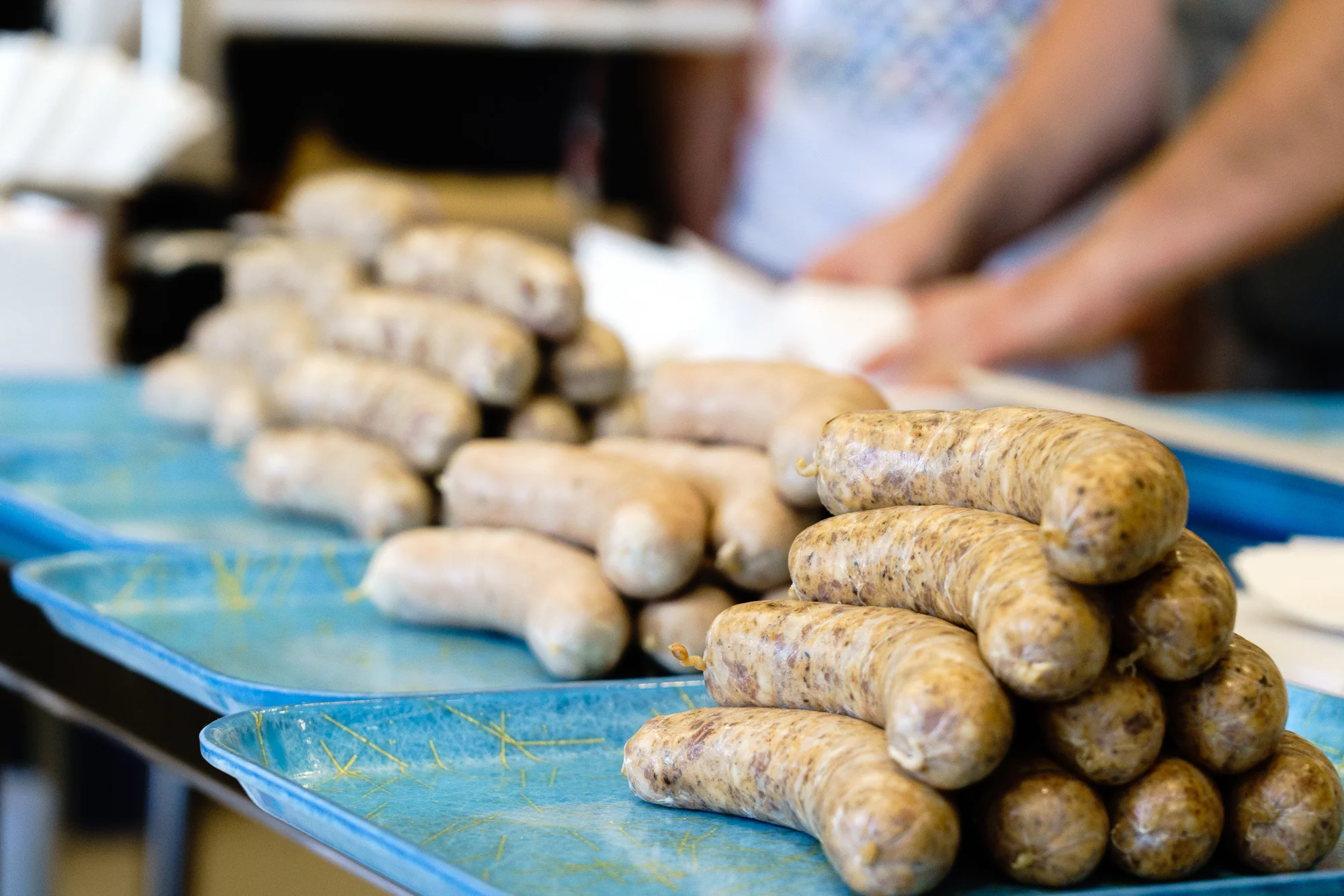 SAUSAGES Often sausages are mishandled in the cooking process and split, losing their juices, and end up on your plate dry. To avoid such catastrophes take your time and go slowly. On the grill: Always cook sausages indirectly on the grill. Check for doneness with a gentle squeeze or a thermometer. The casings should slowly dry so you get a nice snap, and the inside should just reach 140F. Rest for five minutes and eat! On the stovetop: Slow and steady wins the race here. Cook in a heavy bottomed pan on low-medium. They should take 10-15 minutes rotating slowly as they brown. Pull them when they reach an internal temp of 140F