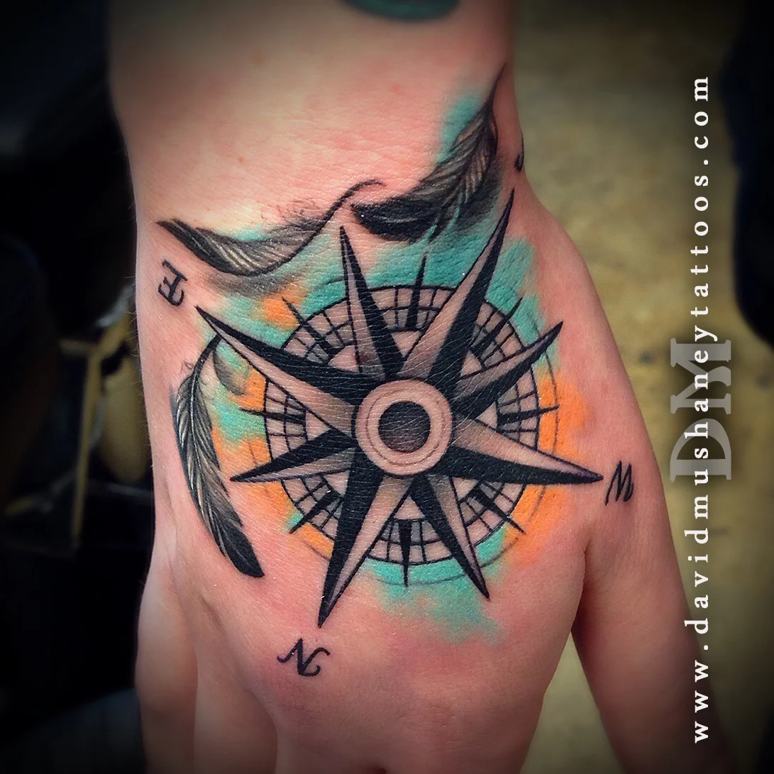 Compass and Feathers Hand Tattoo by David Mushaney