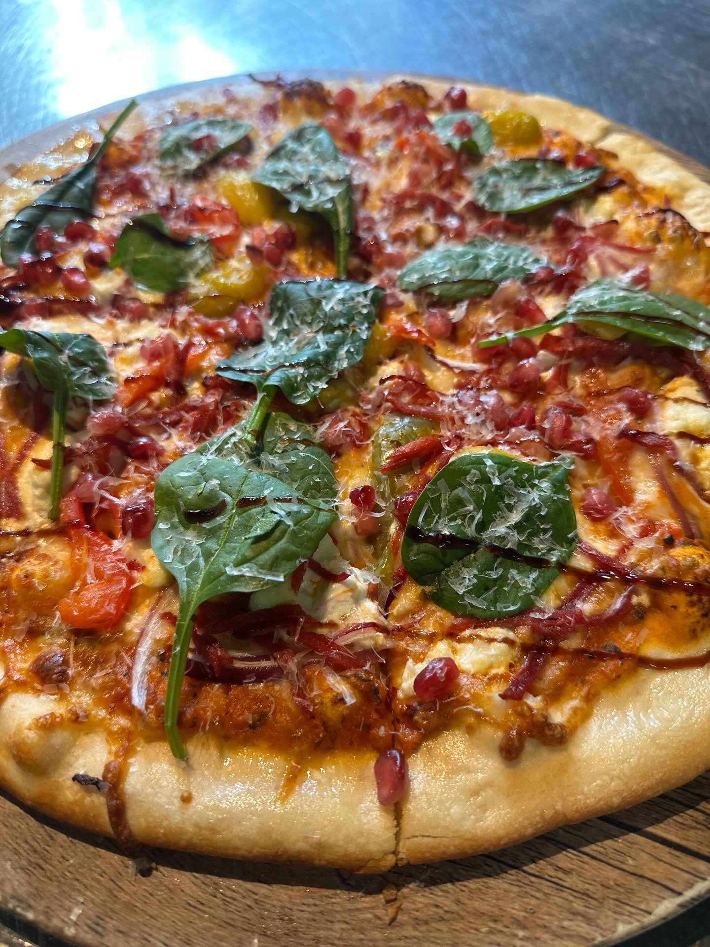 Pizza Special: Vodka sauce, mozzarella &amp; goat cheese, Calabrese, red onion, cherry tomatoes, and spinach&mdash;finished with fresh pomegranate, grated Parmesan, and a balsamic glaze 🍕🇮🇹