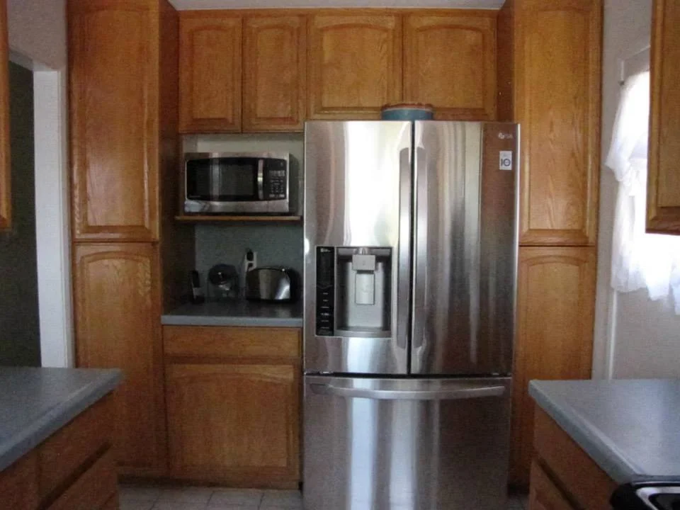 You can see the cupboards and countertops, while not terrible, just look aged.