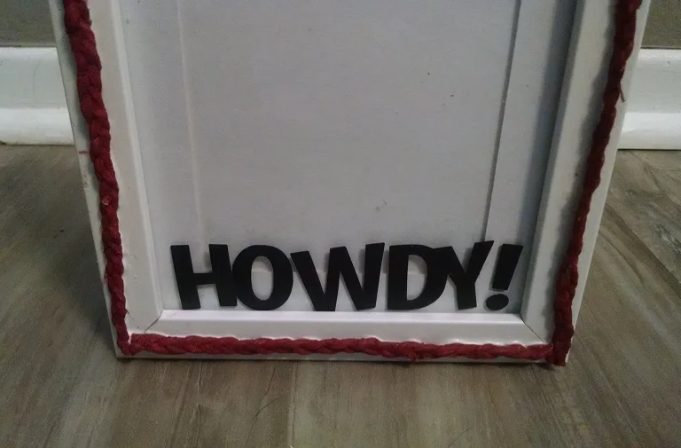 I embellished it with braided rope that I dipped in paint to match the nursery color scheme 