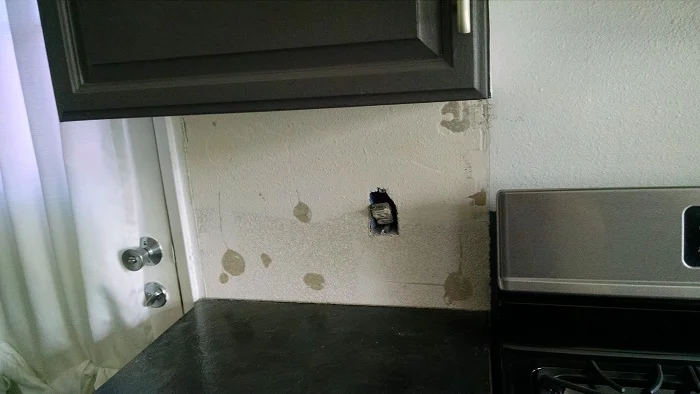 You can see the wall clearly here and what I had to fix BEFORE countertops could go in.