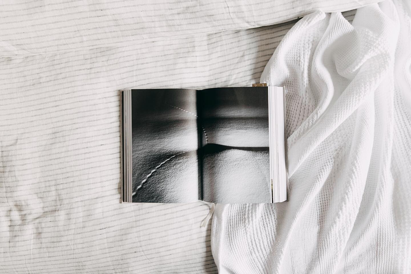Dreaming of cozy winter afternoons inside tucked between @abode_living linens and a deeply engaging photography book.