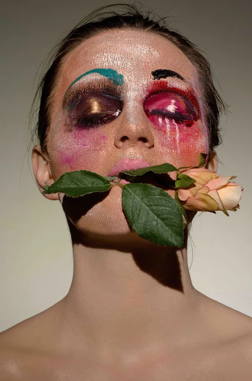  La rose dans la bouche by Ellis Faas What is your favorite product for photo-ready radiance? Recently, I launched Glow Up , a line of three powders. The particles are so fine, they look more like porcelain than glitter. They help create a natural halo for photos, apply to the parts of the face where the light hits: the cheekbones, the curvature of the nose, Cupid's bow and collarbones, to emphasize the bone structure for a radiant and natural glow. In this image, I wanted to translate the idea of the mask in a beauty shot. The pink lips are just for fun!