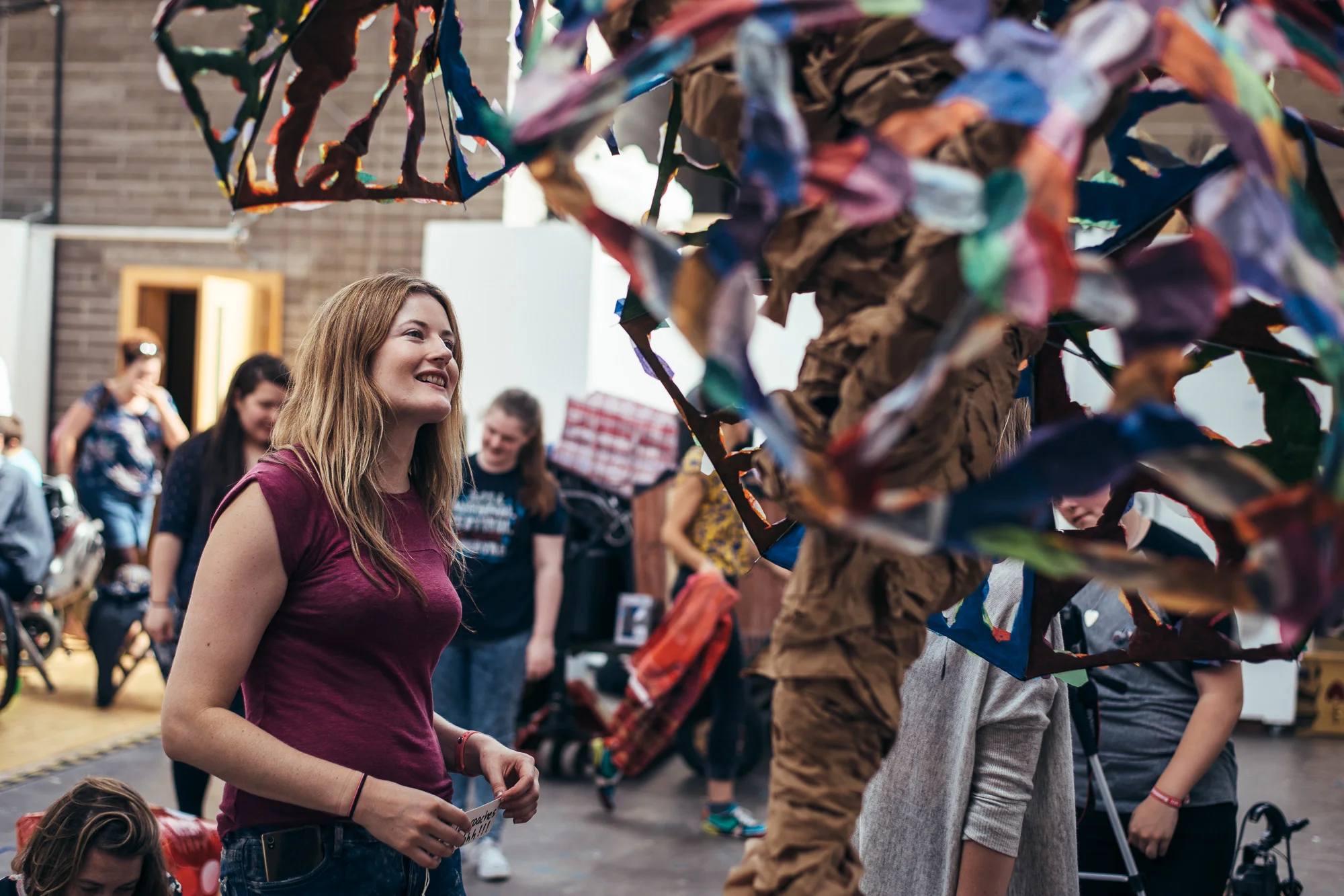 Writing out a childhood memory to stick on our memory tree at Forest Fringe