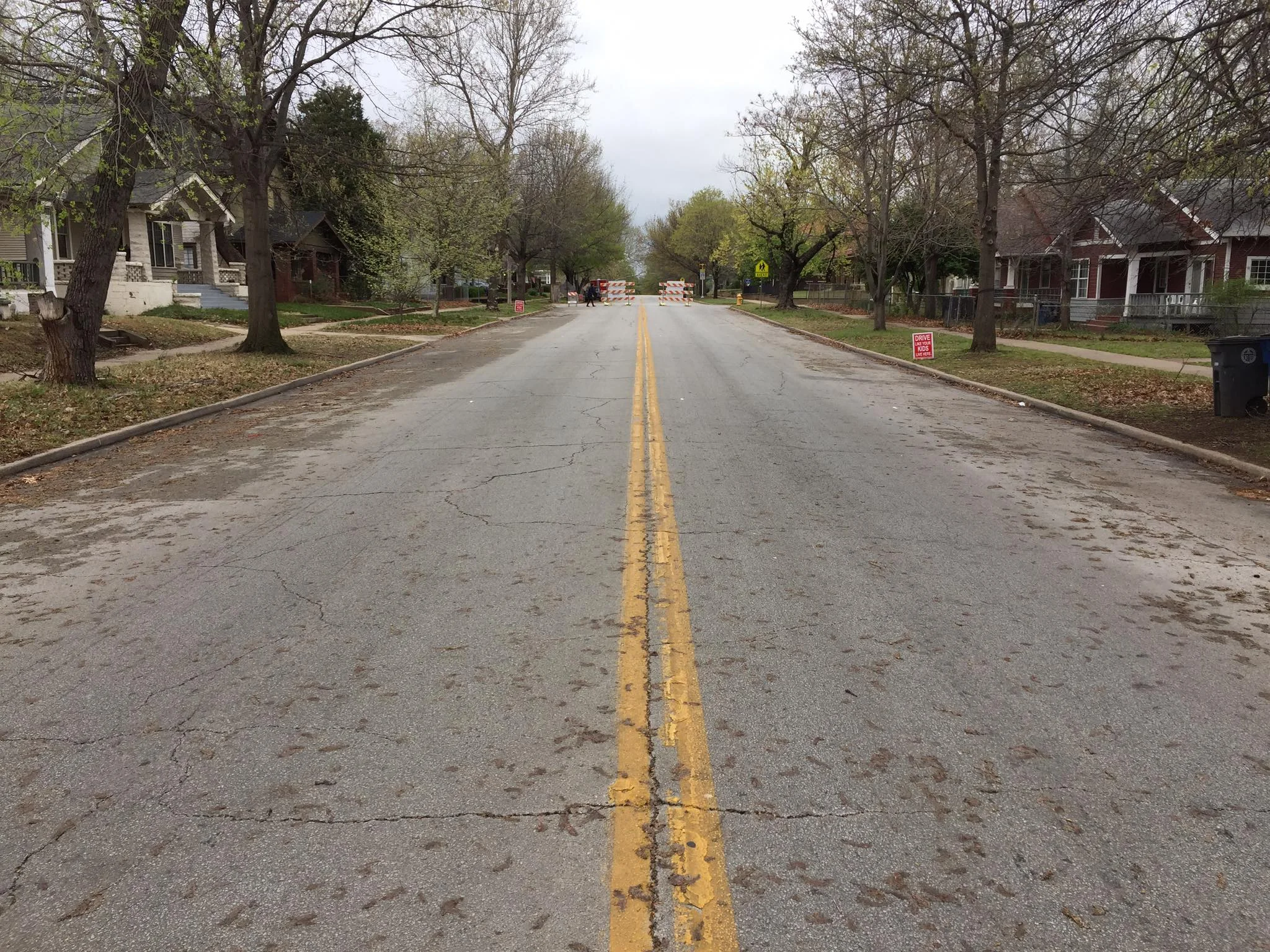 A view of North Denver Avenue that few people have seen; completely devoid of parked cars or vehicle traffic, the full width of the street can be easily appreciated. (Photo © 2017 Brian Parker)