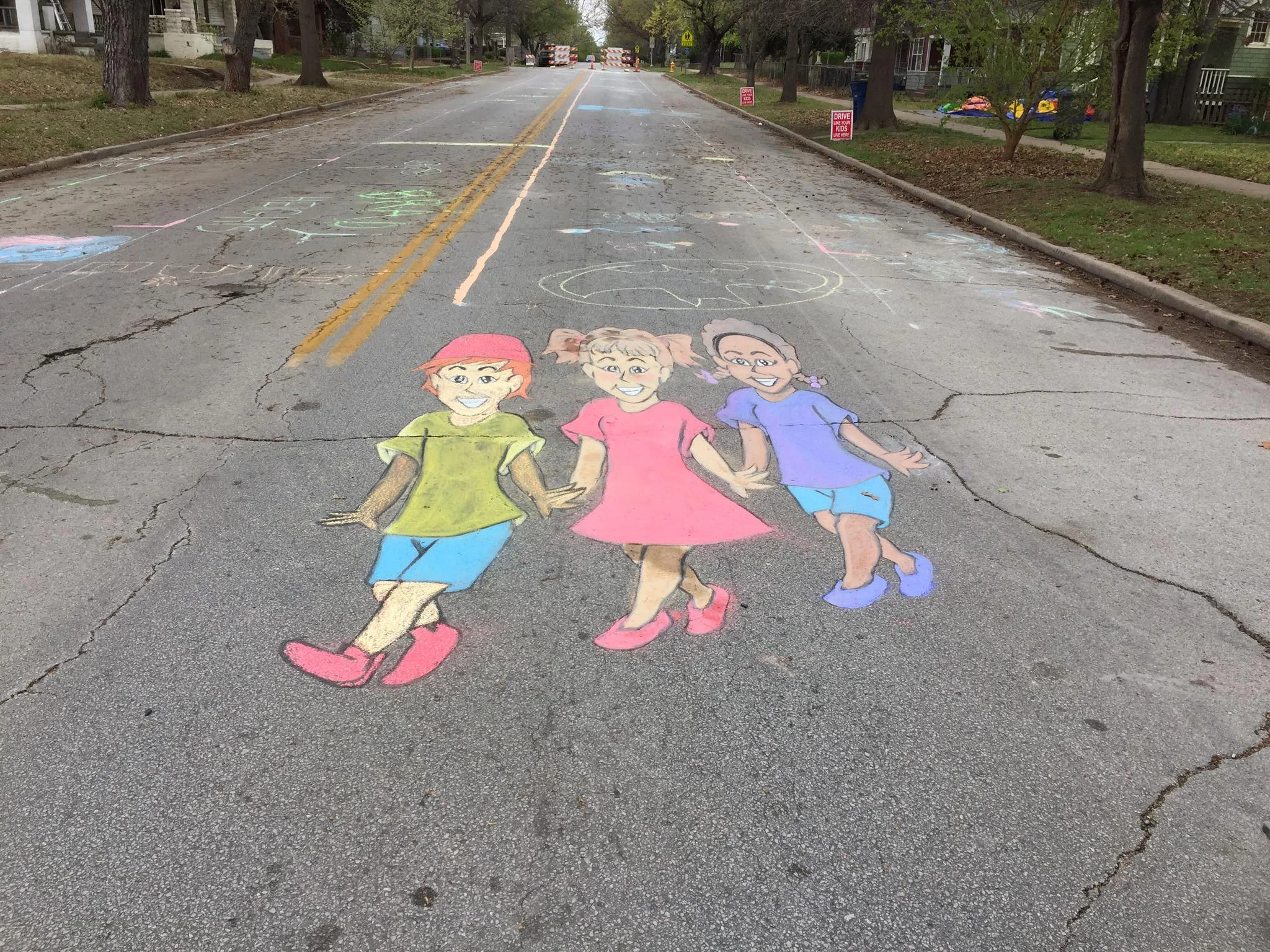 The final product of the 3D crosswalk design created by chalk artist Amber Crismond and completed during the "Chalk the Walk" event. (Photo © 2017 Brian Parker)