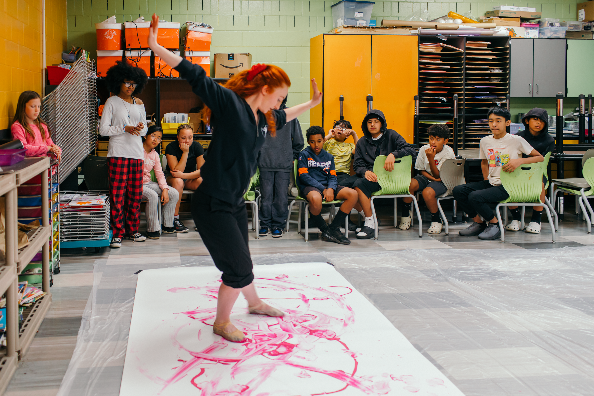 Ballet Des Moines Artist-in-Residence Olivia Valentine and BDM company dancer Megan Boyette, in class with students at Findley Elementary, based on a BDM collaboration with By Degrees Foundation.