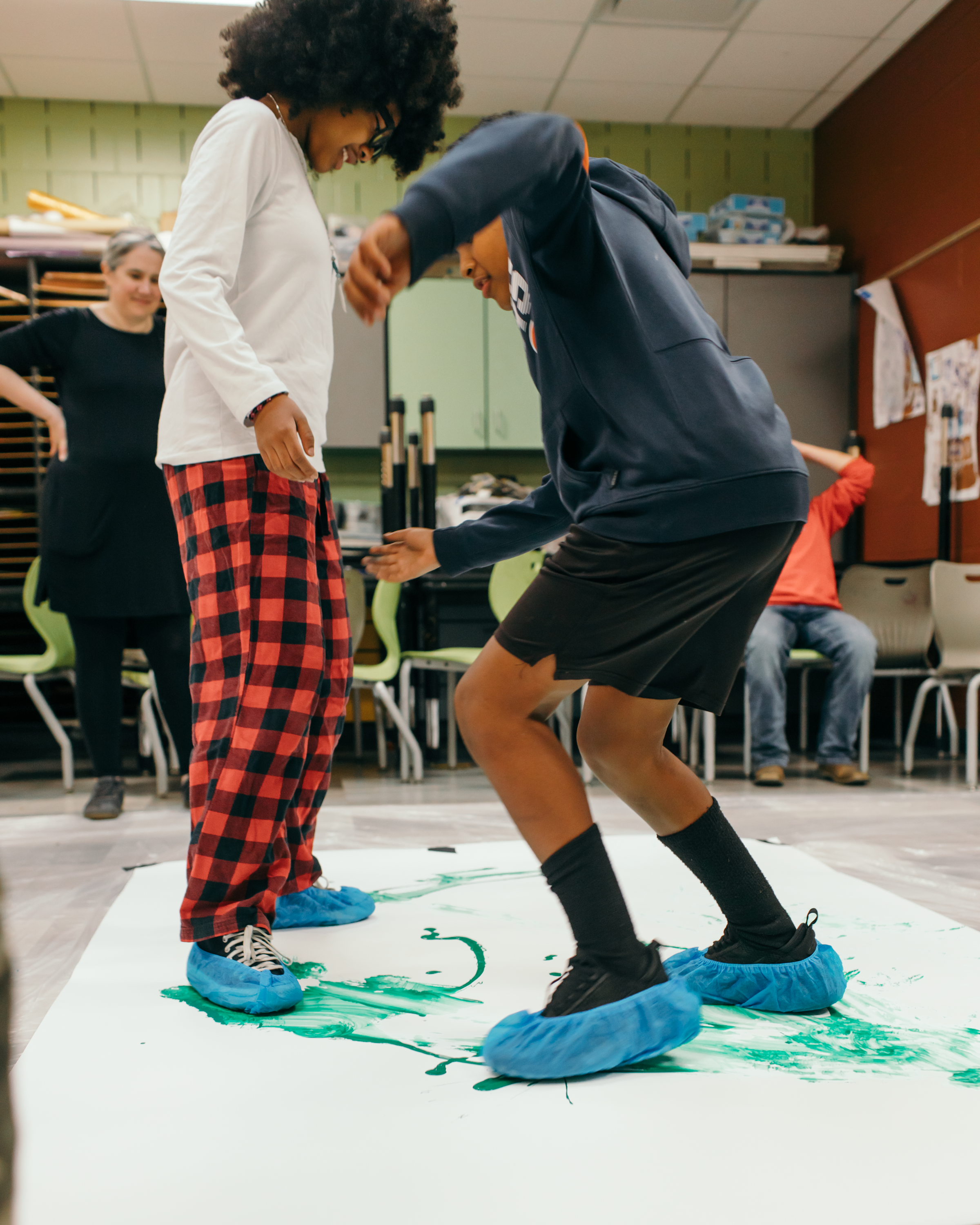 Ballet Des Moines Artist-in-Residence Olivia Valentine and BDM company dancer Megan Boyette, in class with students at Findley Elementary, based on a BDM collaboration with By Degrees Foundation.