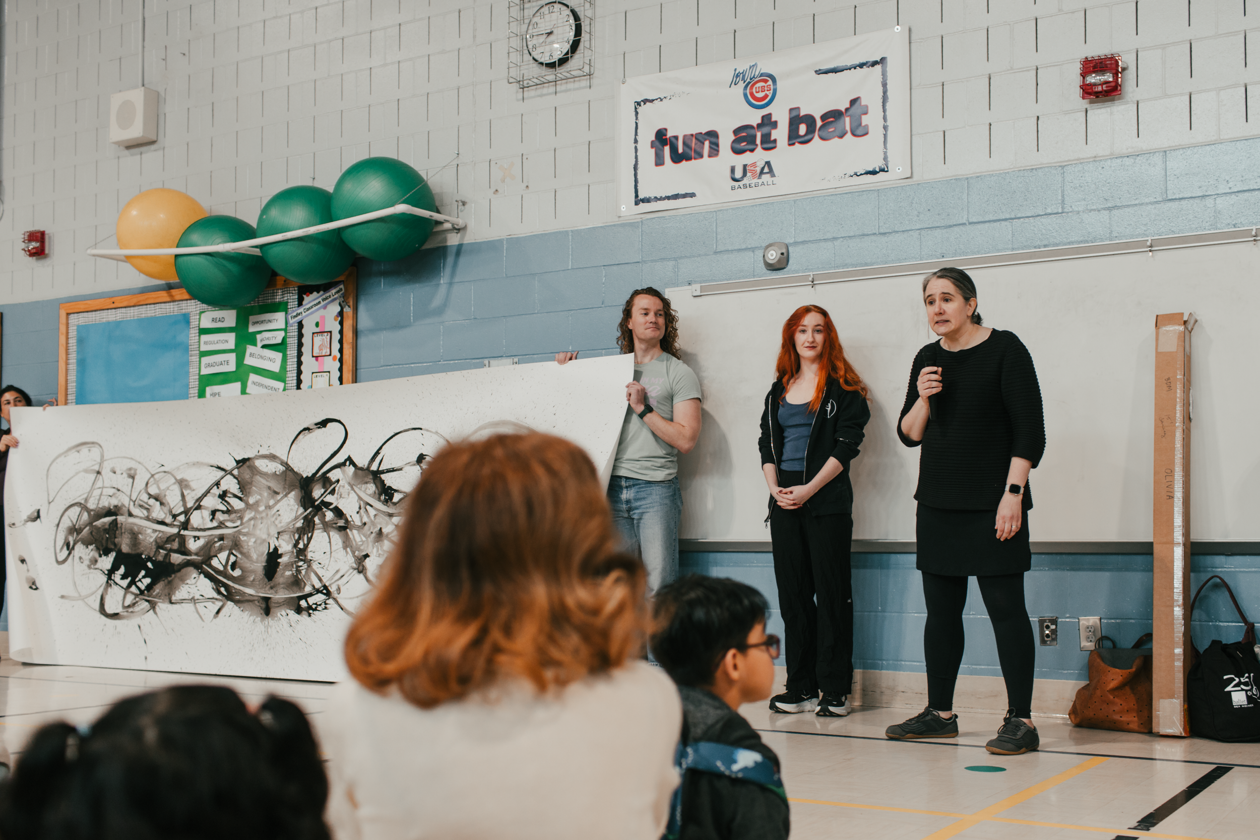 Ballet Des Moines Artist-in-Residence Olivia Valentine engages with students at Findley Elementary, based on a BDM collaboration with By Degrees Foundation.