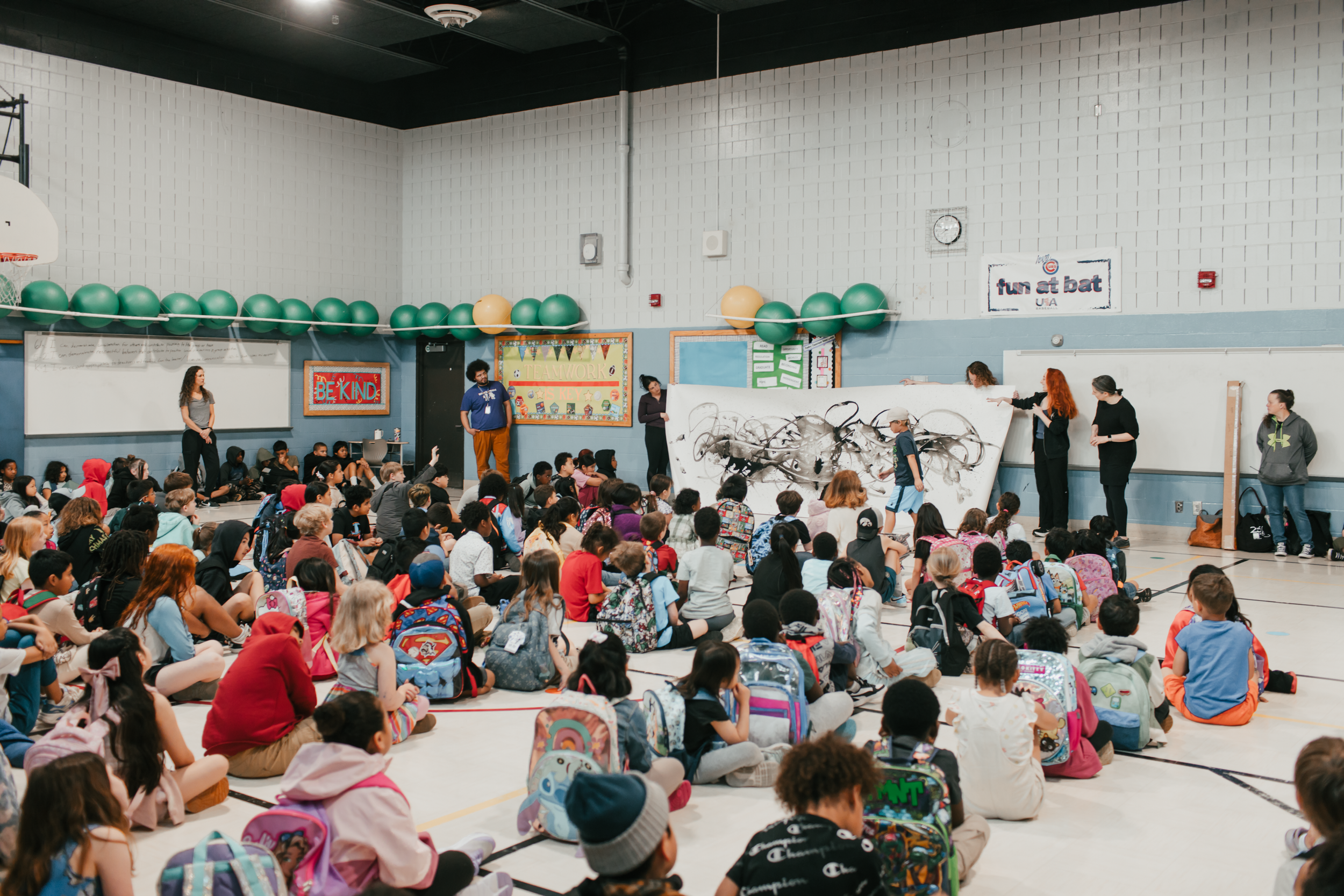 Ballet Des Moines Artist-in-Residence Olivia Valentine engages with students at Findley Elementary, based on a BDM collaboration with By Degrees Foundation.