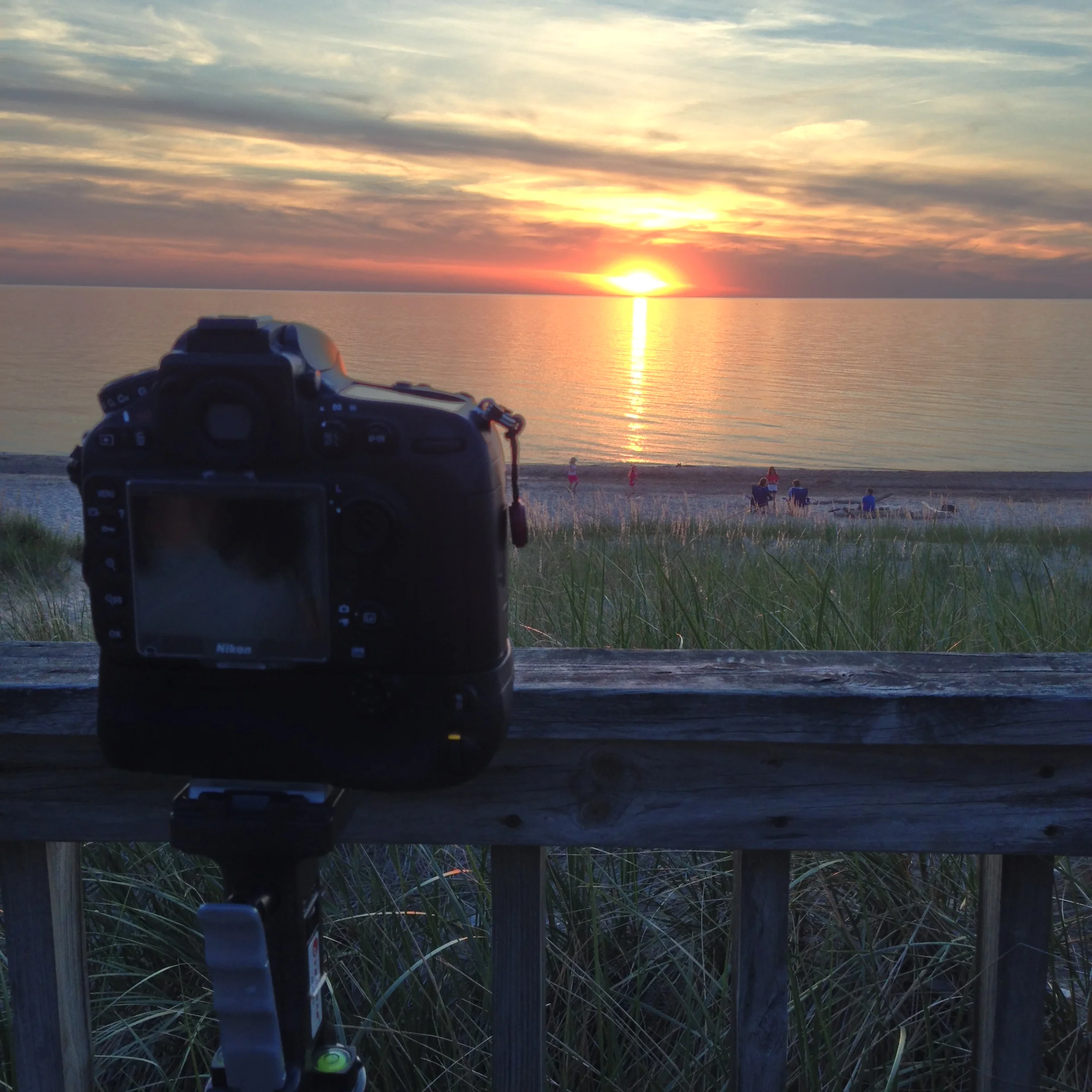 I tried new things when circumstances enabled me to get a new, fancy DSLR. Like picturesque time-lapses of sunsets over Lake Michigan.