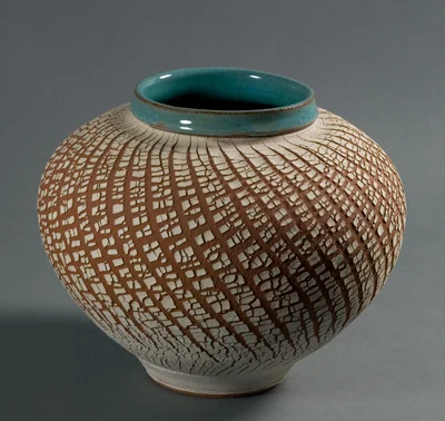 red vase with sodium silicate design