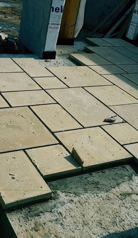 Peacock pavers are typically set with a 1/2" joint. We are also using a 1/8" slope to control wind blown rain at the gazebo. A beautiful stair system and landing are across the courtyard.