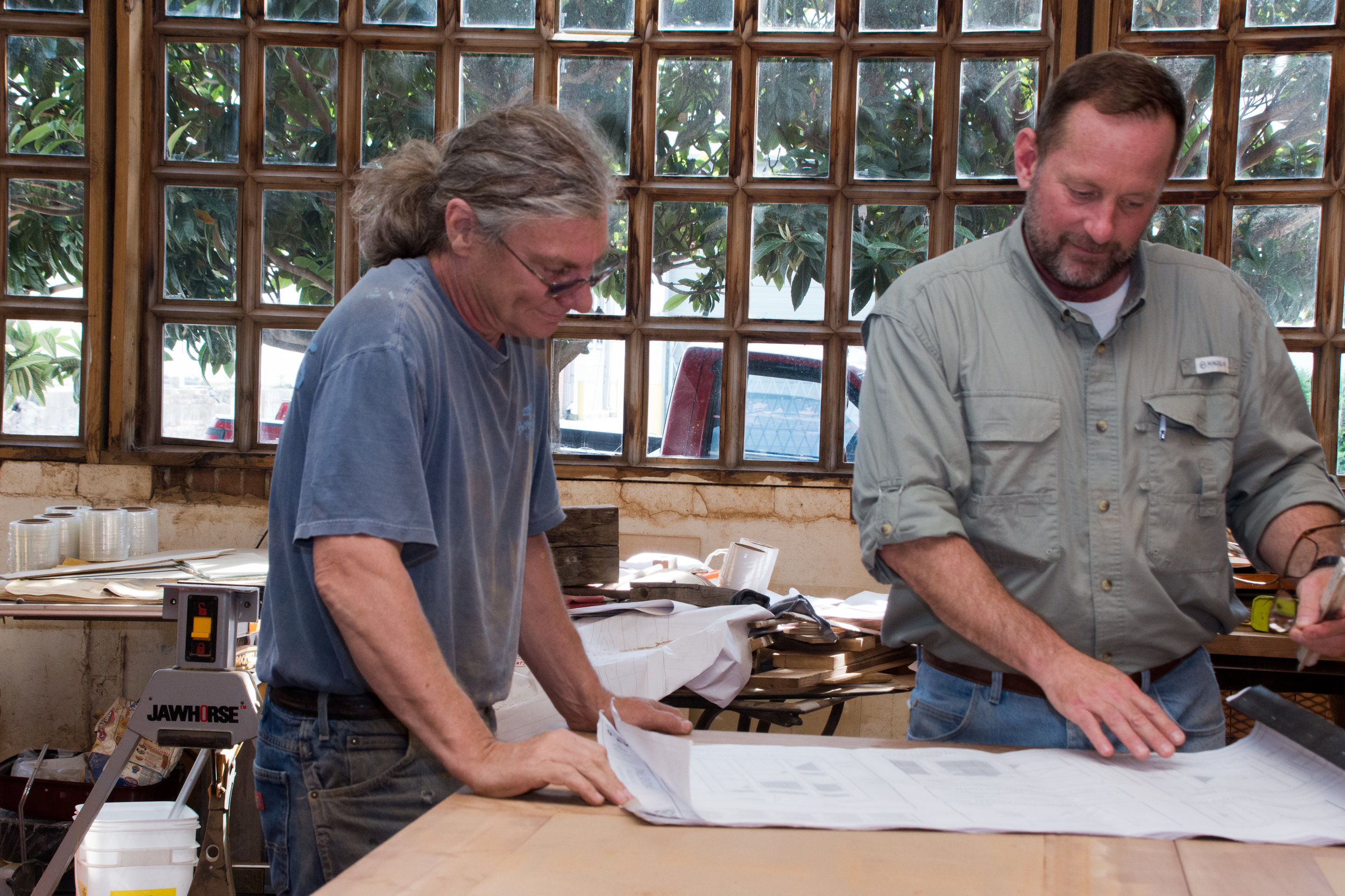 Sleeves rolled up doing what we love to do. Jim Miller (L) and Steve Ray (R) looking over details for exotic beams and brackets.