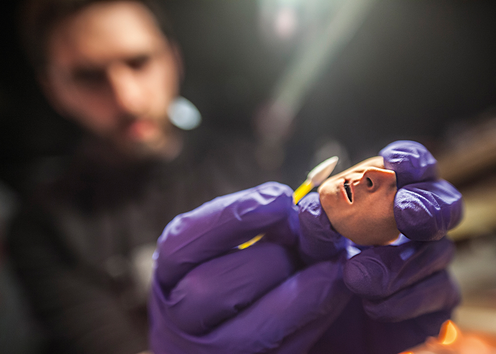 One of Michael's lower face plates gets a final touch-up before shooting.