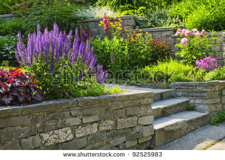 stock-photo-natural-stone-landscaping-in-home-garden-with-steps-and-flowerbeds-92525983.jpg