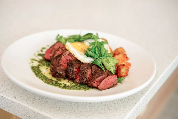 The hanger steak with fried egg and potatos