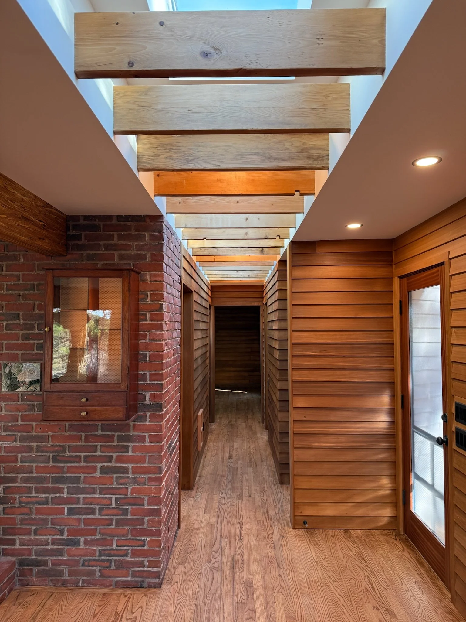 2025_Roland_Goldberg_Wellfleet_52_IN_fireplace hall_Sweeney.JPG