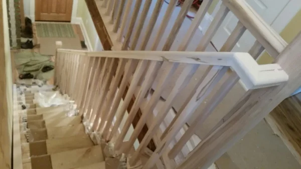 1-3/4 x 2-3/4" Wormy Maple standard railing, 3-1/2 Chamfered Contemporary Post, 1-5/16 Chamfered Wormy Maple spindles. Job Location: Toronto, Ontario
