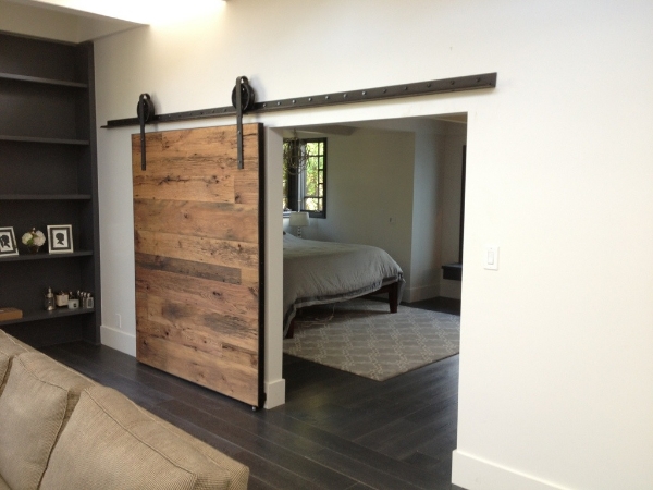 cool-barn-door-track-system-and-black-wood-floor-idea-feat-contemporary-rectangular-bedroom-rug-design.jpg