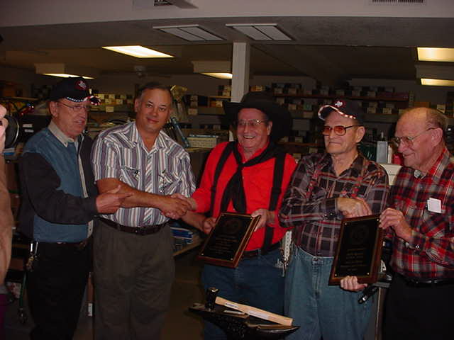 C.B. Jolly center in red shirt.