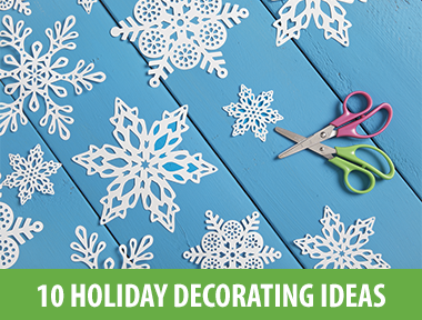 Festive up your home — both indoors and out — with these 10 easy-to-create Christmas decorations, crafts and centerpieces. 1) Make Ice Lanterns Get an assist from Mother Nature (or your freezer) to turn plastic cartons filled with water into magical ice lanterns to display either indoors or out. Make your own with these tips . 2) Glow It On This how-to explains how to create these illuminated grapevine sphere topiaries for your front porch. The waterproof lights ensure they'll brighten up your entry even during stormy winter weather. 3) Fake a Roaring Fireplace Apartment dwellers and urbanites: this project's for you. Get creative to craft a spot to hang your stockings and lend a little Christmas cheer to any room. Our step-by-step instructions show you how to turn a canvas dropcloth, drapery hardware and chalkboard paint into this clever faux mantel wall hanging that you can simply roll up and store when the holidays are over. 4) Craft an Upholstered Banner Cheerfully issue a Christmas greeting to all who enter your home with this DIY upholstered holiday banner . Swap out the letters to easily craft more banners for birthdays, Thanksgiving, Halloween, Easter or any other occasion worth celebrating. 5) Fold a Mini Forest Use a circle punch or scissors to cut card stock into various size circles, then accordion-fold the paper to create the look of swagging evergreen boughs. Stack the folded rings and attach to a small wood dowel or cut log slice to easily whip up a whole forest of firs. 6) Make 3-D Upholstered Trees Basic upholstery materials and techniques are all you need to craft these fabric-covered trees that fold flat so they're a cinch to store between holidays. Learn how to make your own with these step-by-step instructions . 7) Add Some Sparkle These gorgeous, glittering votives only look expensive. Using glitter, glue and an empty jar, you can easily craft them yourself on the cheap. 8) Wintry Blooms Create a floral centerpiece that incorporates warm holiday hues and that will instantly liven up your dinner table. Brittni Mehlhoff arranges various red flowers, berries and succulents in a rustic wicker basket. (You can choose any vase that suits your style.) Use floral wire to tame stubborn stems and plants, add pinecones around the base and you're ready to host for the holidays. 9) Craft a Snowy Wreath Add faux greenery, flowers, berry sprigs and glittered pinecones to a grapevine wreath then cover with faux snow to give your front door a cheery update during winter months. Learn how to make your own . 10) Restaurant-Style Menu Board Let your guests know exactly what's for dinner with a restaurant-style menu board made from a DIY chalkboard. For more seasonal and sophisticated flair, apply gold leaf to a large wooden frame. Guests will never know how easy and inexpensive this was to make. Design by Marian Parsons . Make your own with these step-by-step instructions .