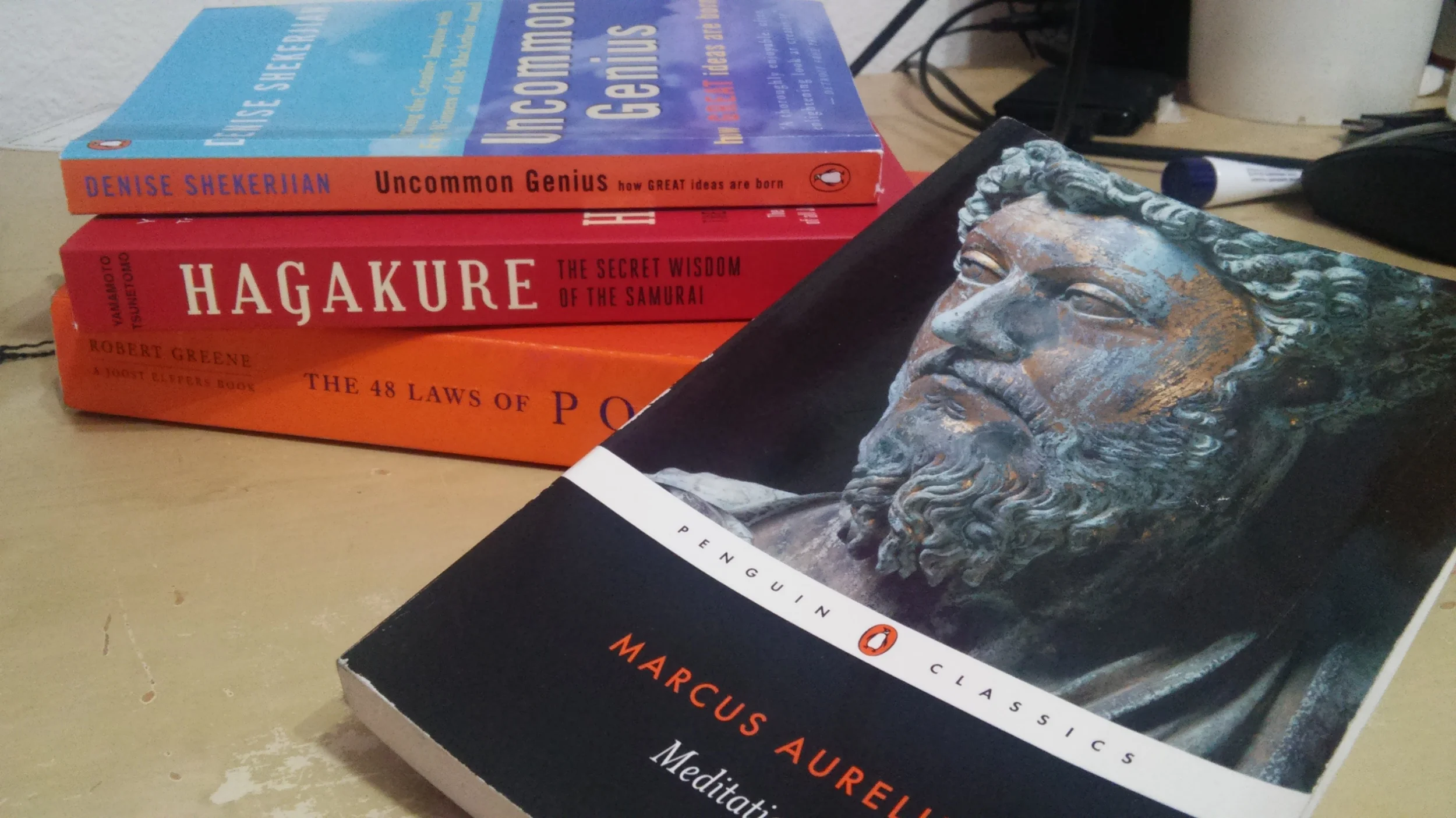 3 books to the left are what's on my plate right now. Meditations I finished late 2014 and it greatly influenced the way I'm currently handling my life. 