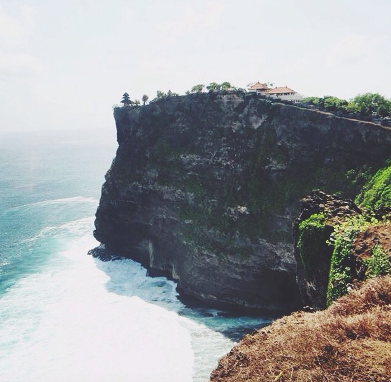 Uluwatu Temple in Uluwatu, Bali at Sunset Is a must