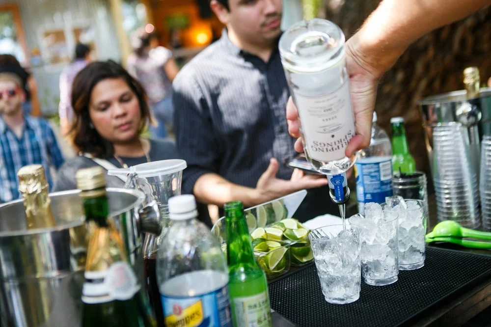 Bartenders mixing drinks for a busy crowd
