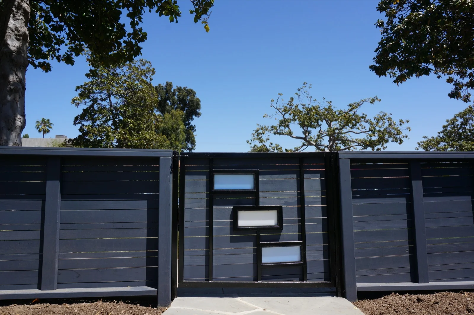 Blue Horizontal Sloping Fence and Custom Plexiglass Gates in Santa Monica