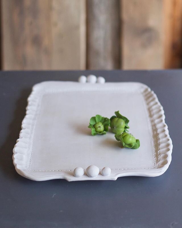 A (greenware) porcelain serving tray with all the charms. ...and the orchard is full of plump baby persimmons! 
#functionalceramics #handbuiltceramics #maker #simplelife #slowlived #craft #studiopottery #decoraccents #smallbatchpottery #potterslife #