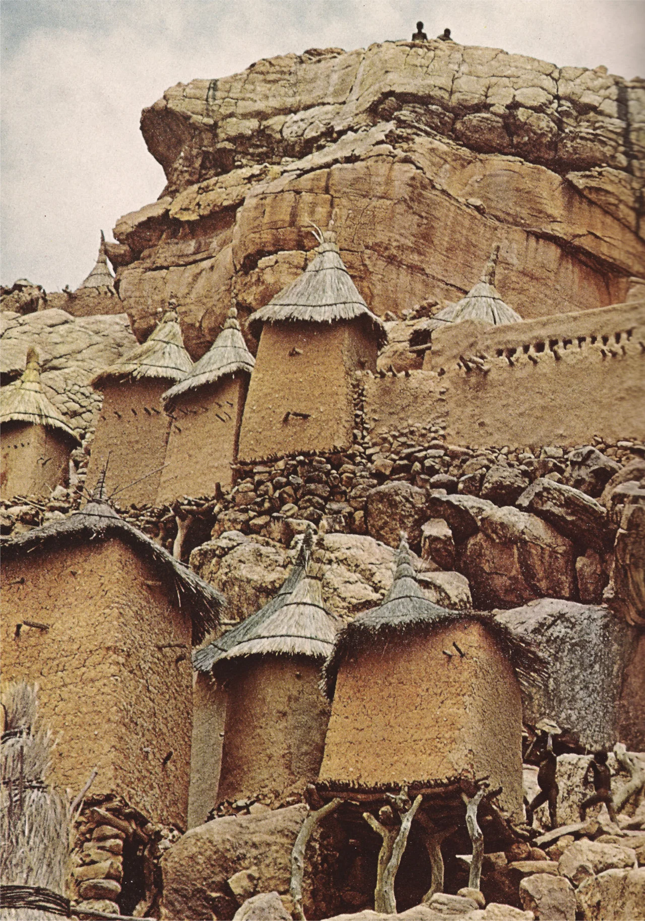 johnny-remember-me:
“Propped by rubble, logs, and faith, a family compound at Yenndouma, Mali, clings to a rock face.” (National Geographic, 1969)