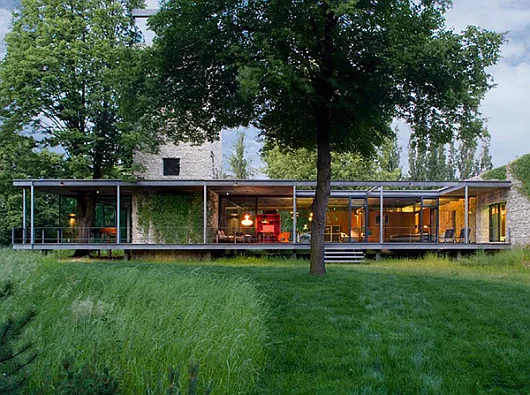 “PCKO Architects in co-operation with MOFO Architects show us how to build beautiful homes with  a minimum footprint and a maximum enjoyment on nature. The Jodlowa House near Krakow shines with its fully glazed facade, floating above the gro…