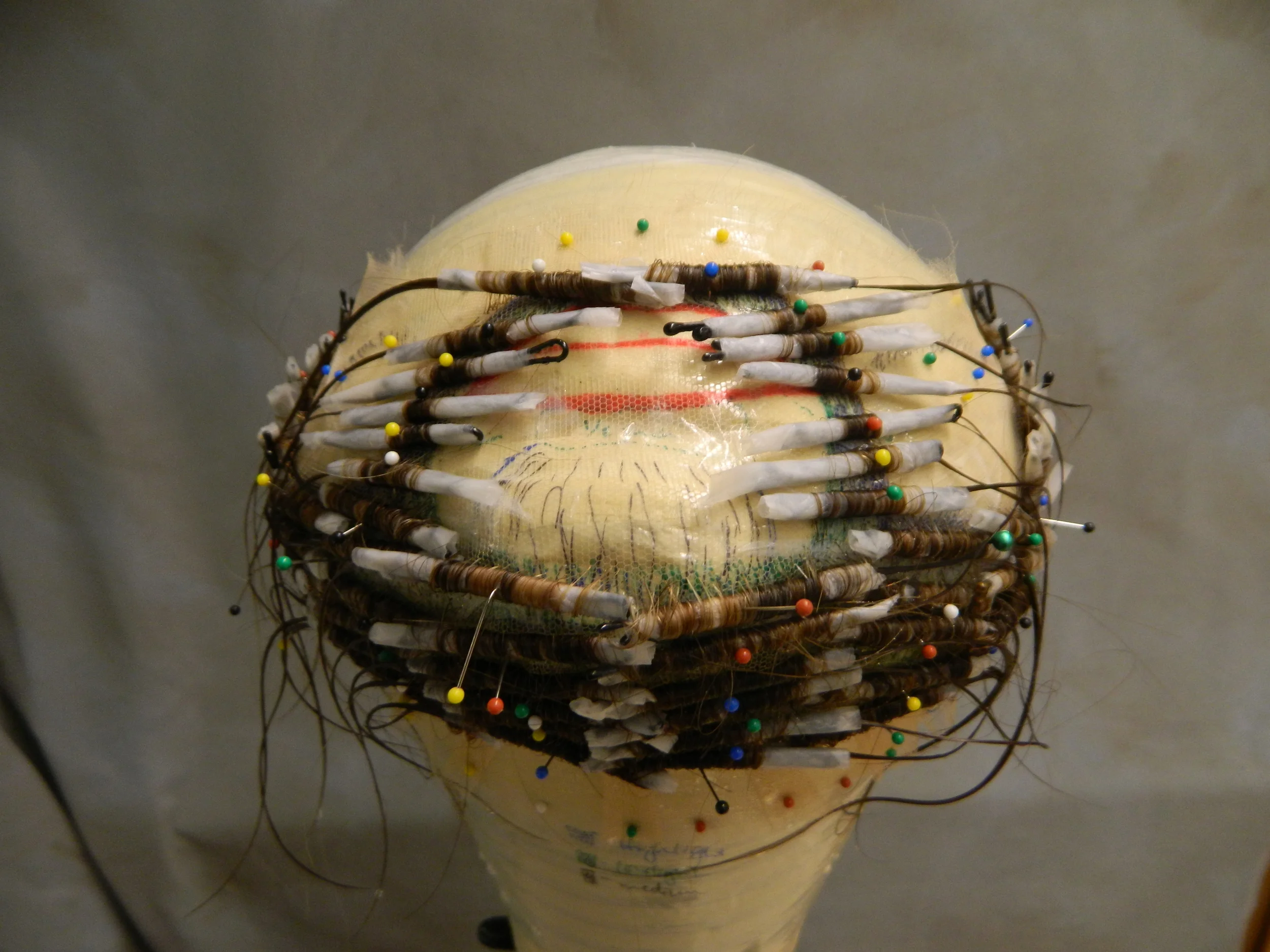  Custom padded block and fully hand tied beard. Bobby-pin permed. 