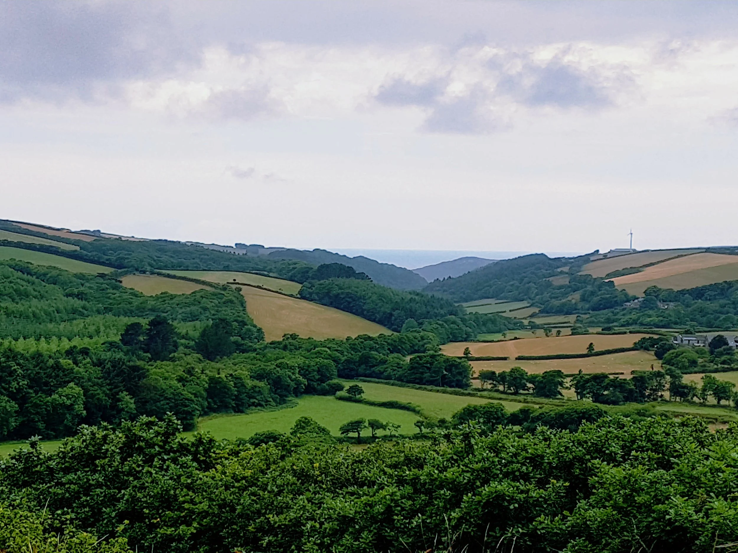 Kilkhampton Castle is a stunning 12th century motte and bailey castle situated on top of a high knoll to the west of the village of Kilkhampton and offers this spectacular view of the Coombe Valley towards the Hartland coast