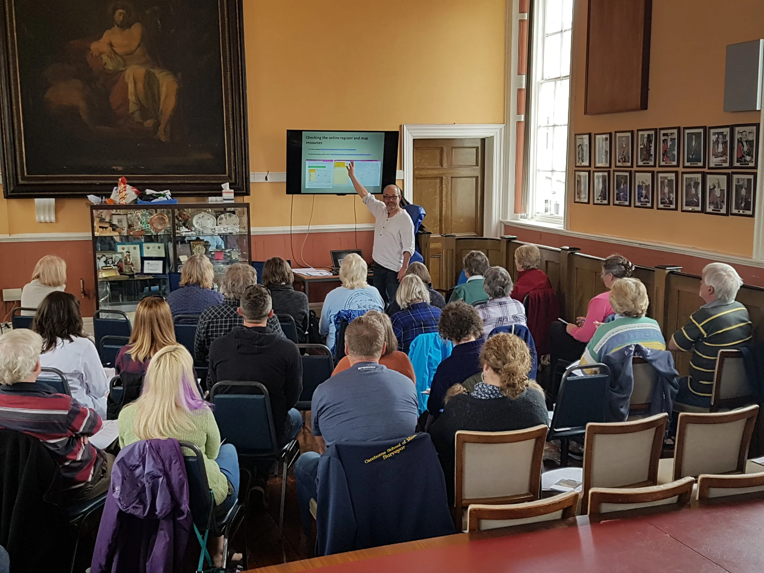 James Gossip of the Cornwall Archaeological Unit shows volunteers how to research scheduled sites using the Historic England website and the Cornwall Council online public mapping website prior to a practical session at Goonhilly Downs