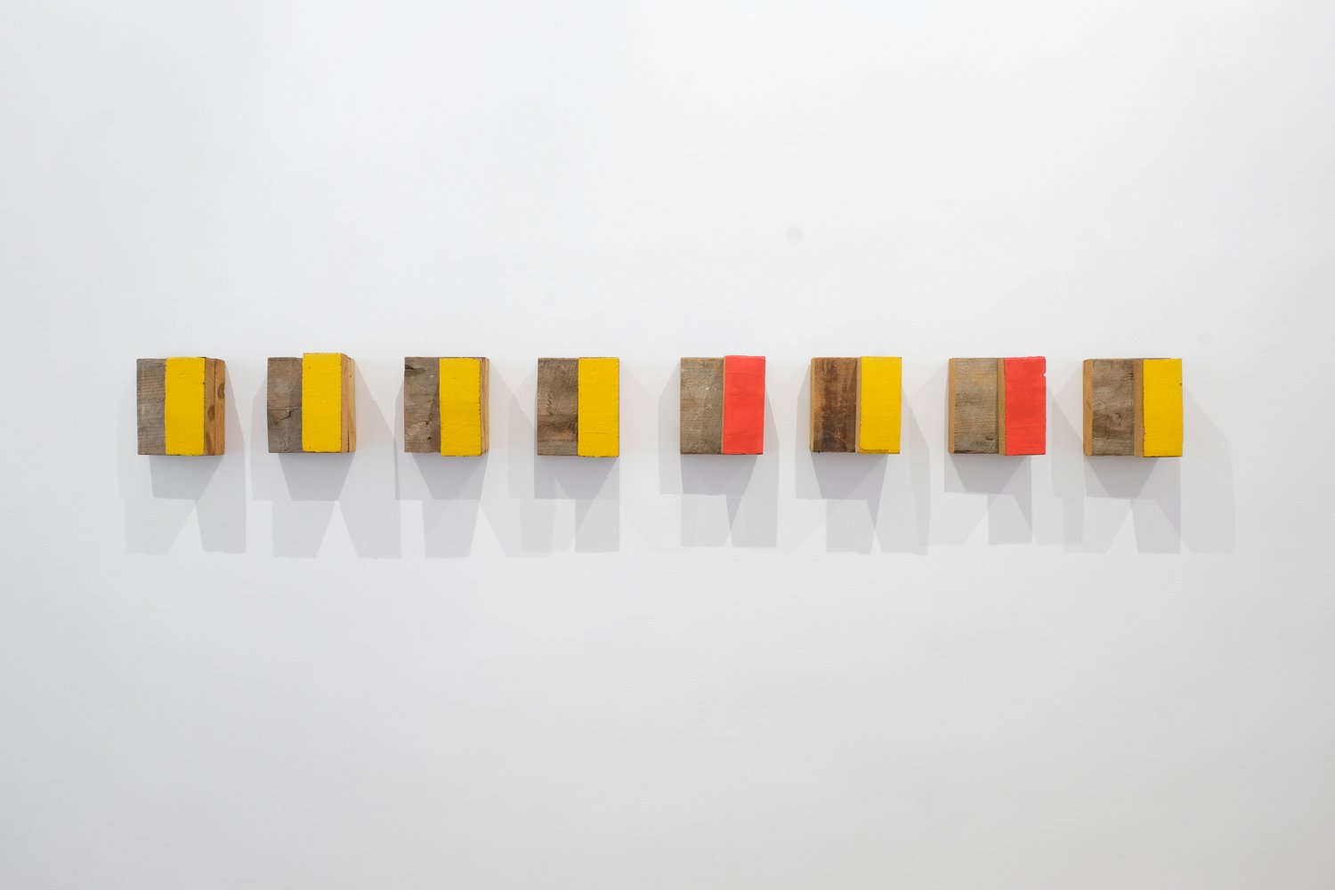   Richard Nonas,     Eight Piece Wall Sculpture , 1990,  Signed and dated on verso  Painted wood  25 x 22 x 15 cm each piece  (RN0017) 