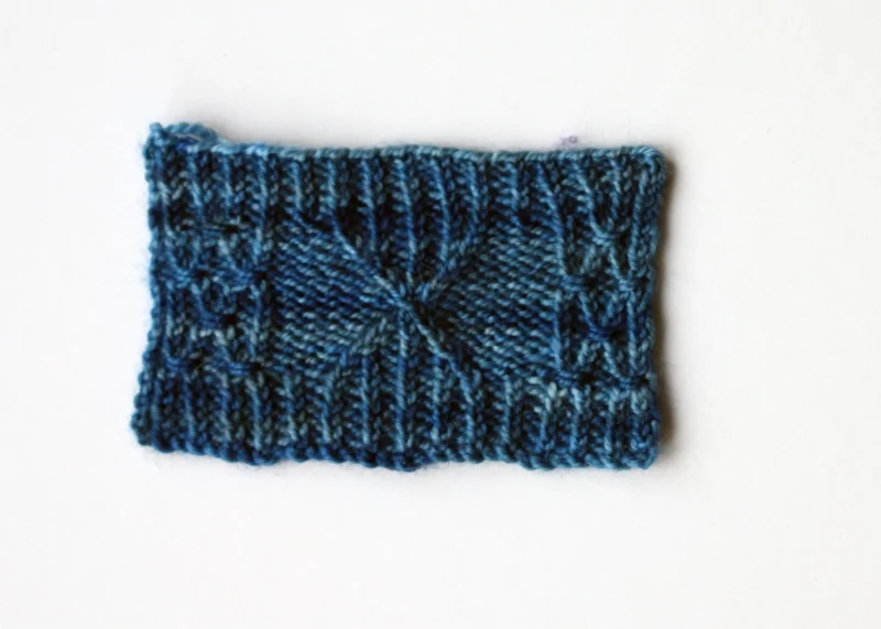 Cabled and twisted stitch swatch knitted in #608/Blue Lagoon, knitted on 2.5mm needles