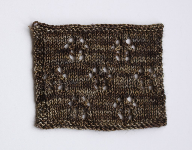 Lace swatch knitted in #603/Silver and Bronze, knitted on 3.25mm needles