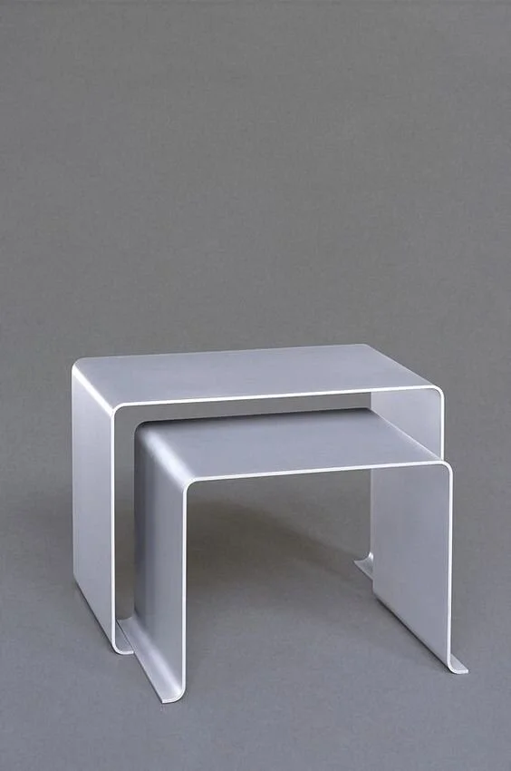 The 621 table, designed by Rams for Vitsœ in 1962, here seen in a perfectly nesting pair. Photo red-dot