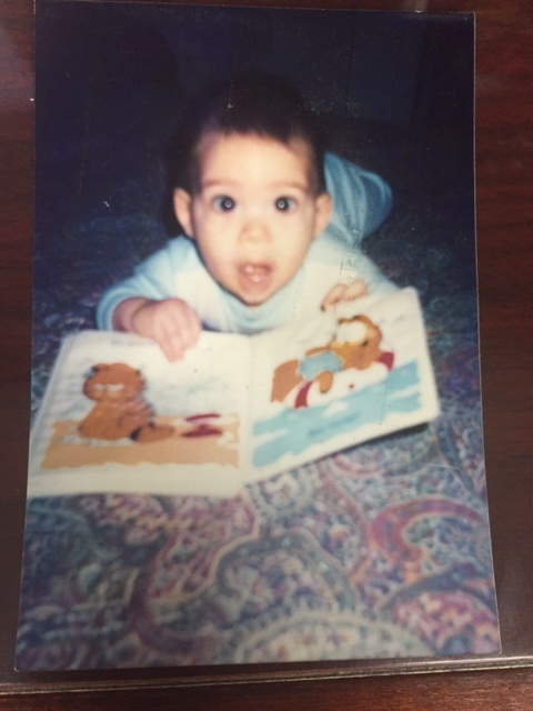 MY son, James, with his first book.