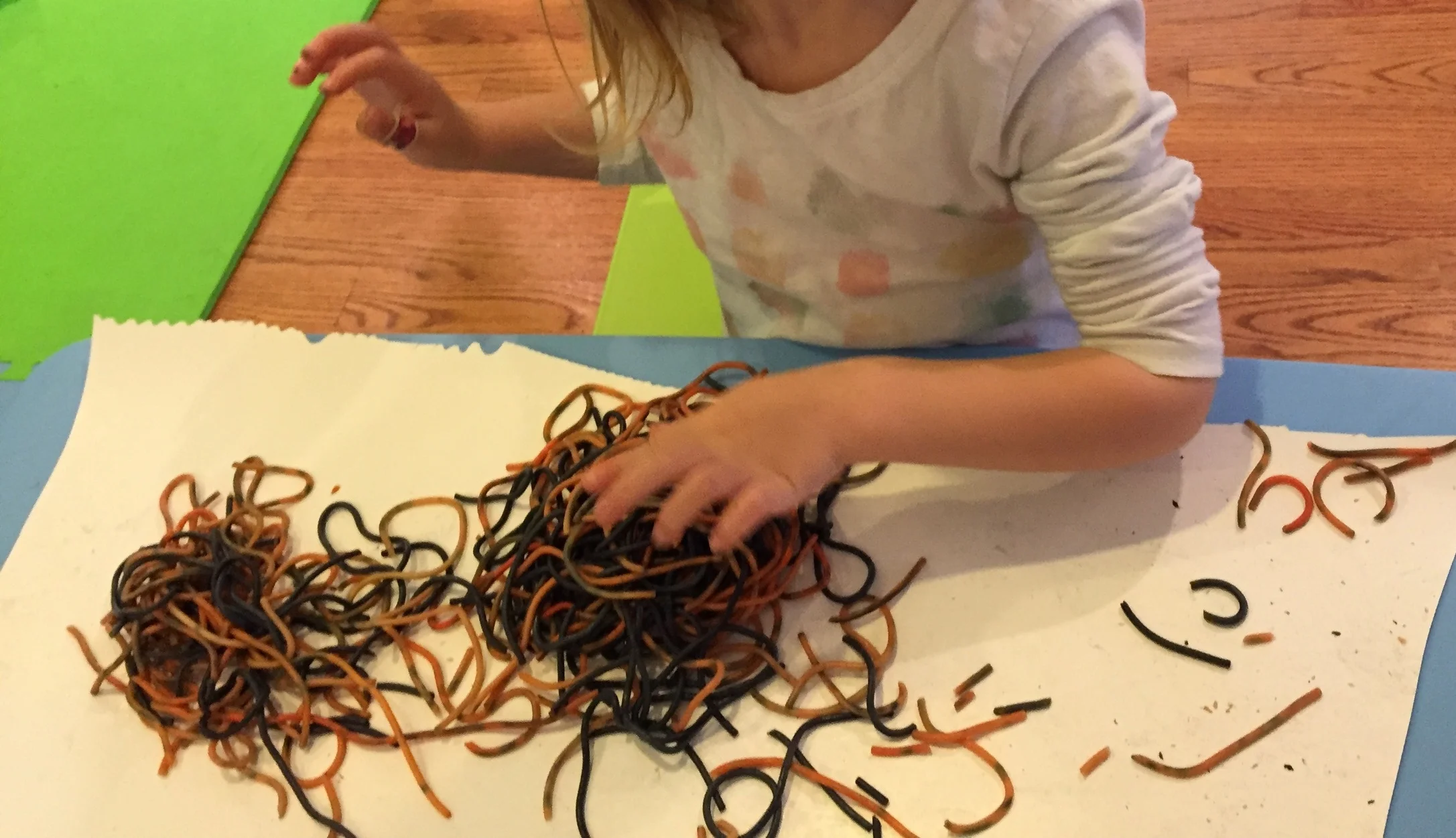 Sensory play with orange and black spaghetti