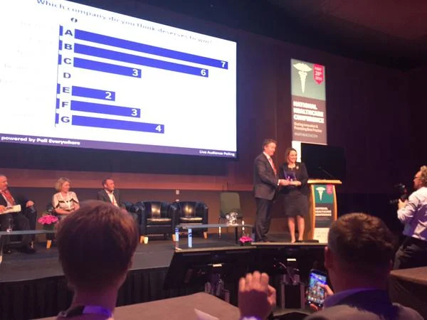 Avril accepting the award from Mr. Eamonn Fitzgerald, Hermitage Clinic CEO on behalf of Team TickerFit ™