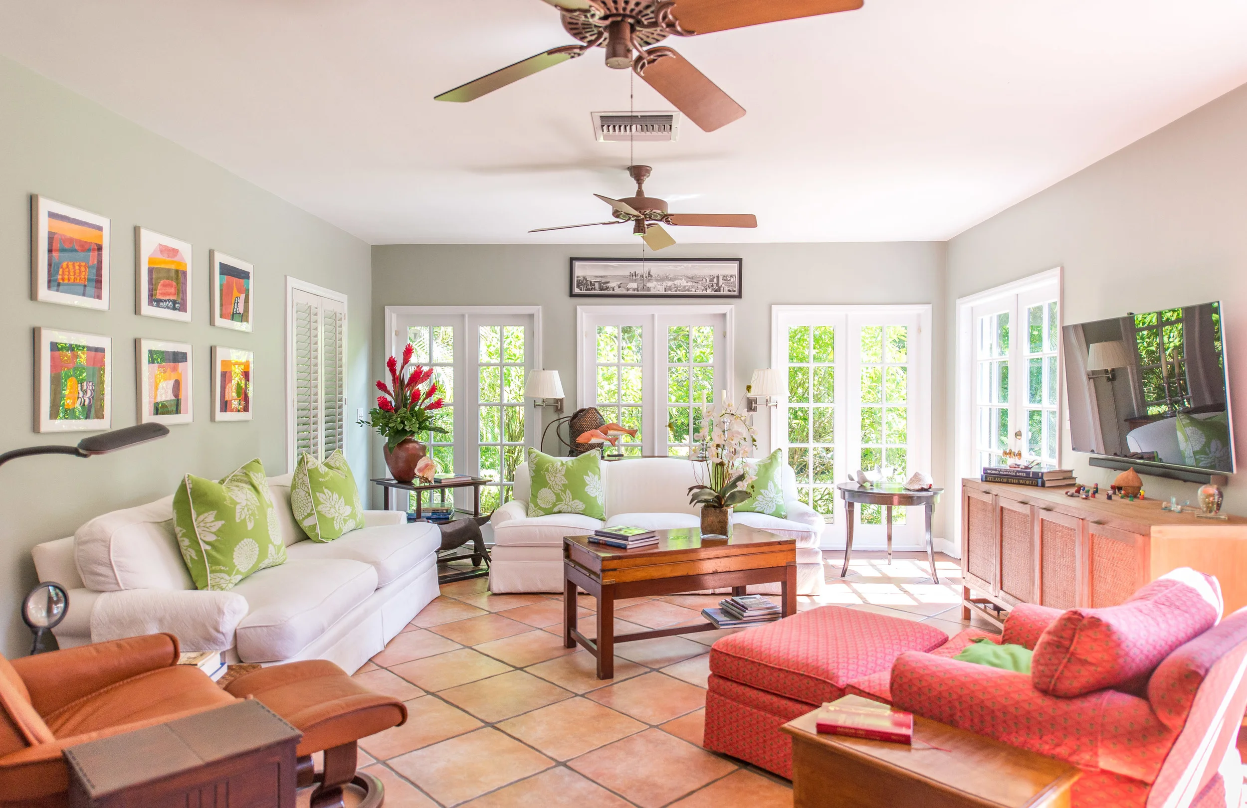 Beautiful and bright family room, lined with French doors, bringing the outside in.