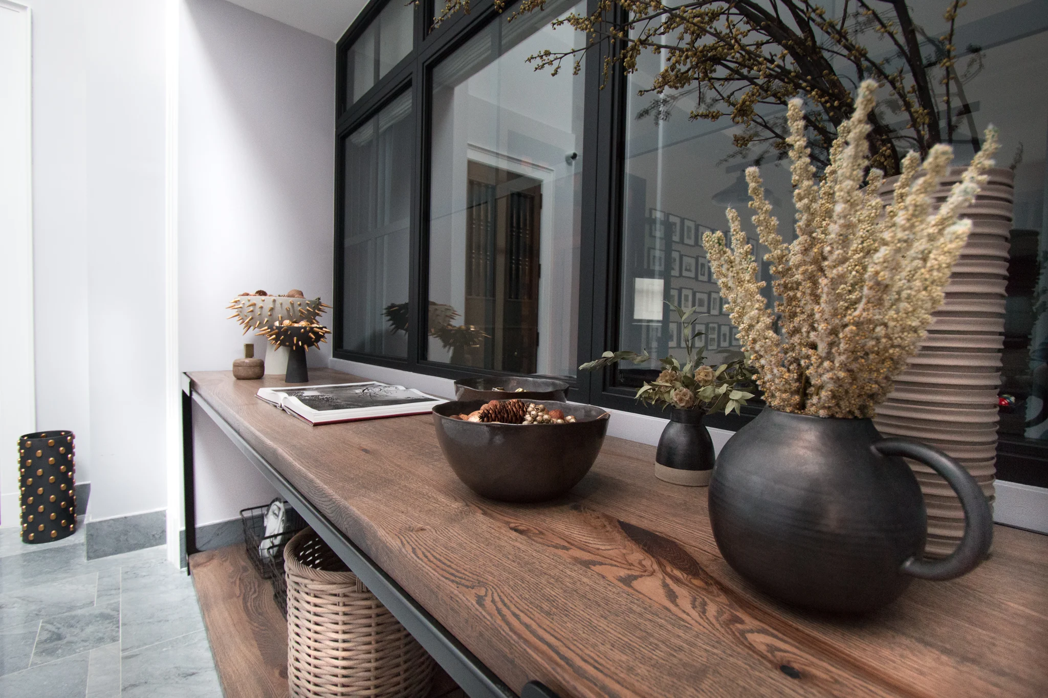 Table by NAFCO Materials: Powder coat blackened steel with oak