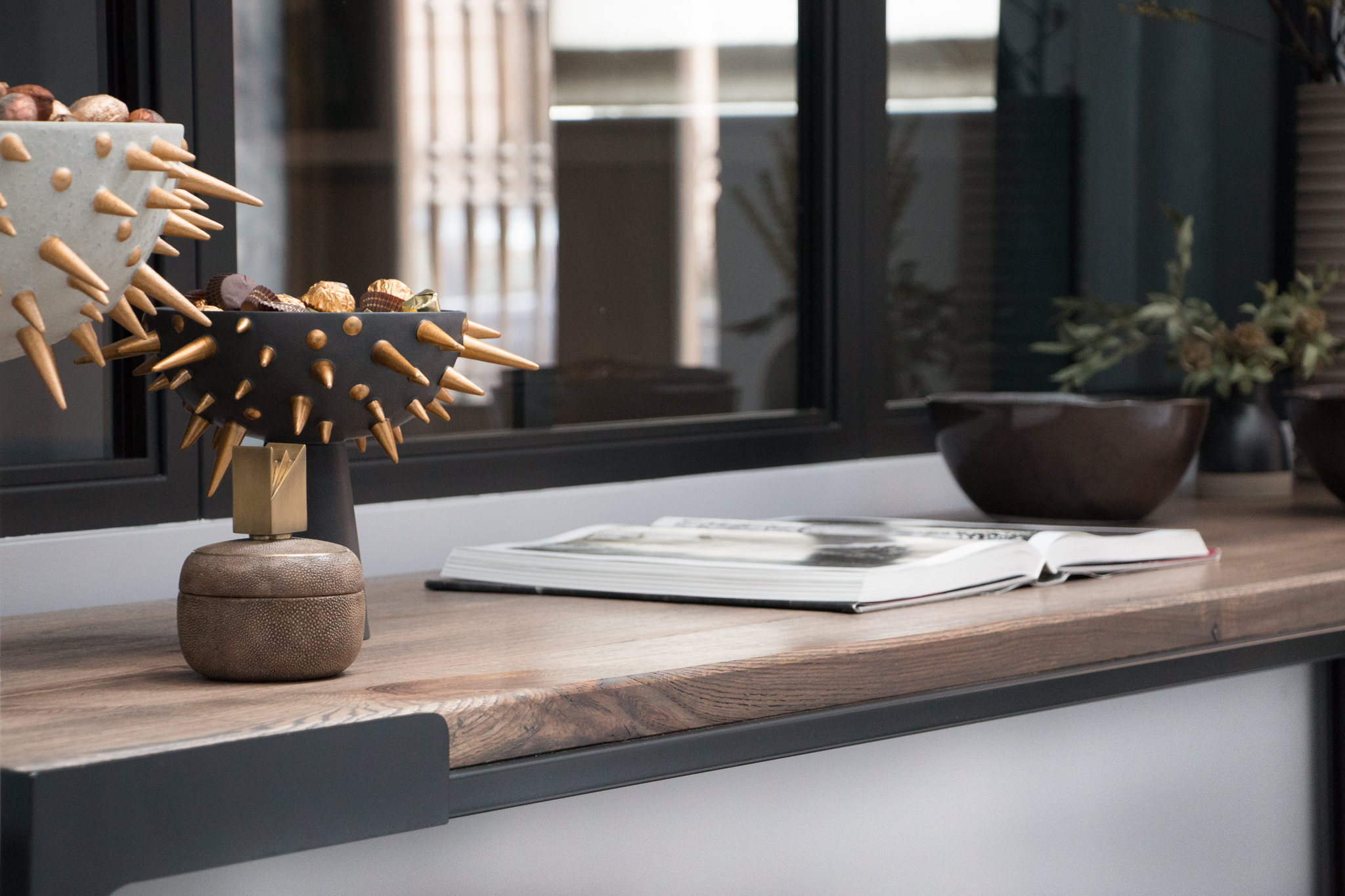 Table by NAFCO Materials: Powder coat blackened steel with oak